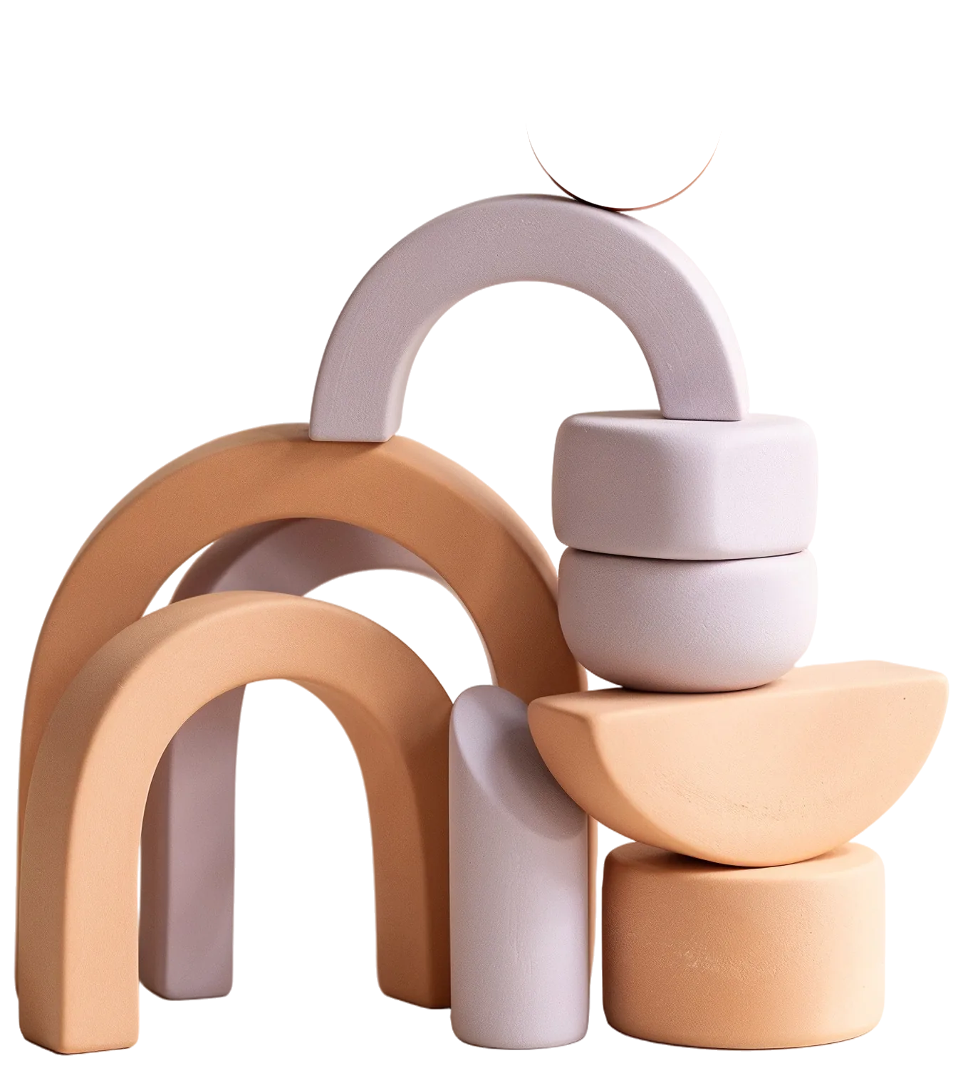 Stacked ceramic arches and blocks in peach and lilac, balanced under a glossy orange sphere